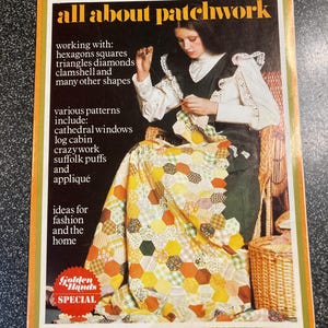 May include: A retro magazine cover, "all about patchwork", shows a woman sewing. The cover details patchwork techniques and patterns, with a focus on fashion and home. The quilt features a yellow, orange, and brown hexagon design. The magazine is a Golden Hands Special.