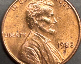 1982-D Lincoln Bronze LD with errors. Red almost uncirculated, D/D, OBV doubling