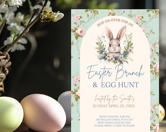 May include: A light blue invitation card with a floral pattern and a white bunny rabbit with a pink floral wreath around its head. The text on the card reads "Hop on over for an Easter Brunch & Egg Hunt hosted by the Smith's Sunday April 20, 20XX From 12:00 PM - 4:00 PM 246 Willow Drive, Fun City RSVP Sarah: (555) 123-4567 Please bring a dish to share".