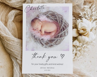 May include: A baby thank you card featuring a newborn sleeping in a woven nest with pink accents. The card reads "Charlotte" at the top, and "thank you" with a heart, followed by a thank you message and the date.