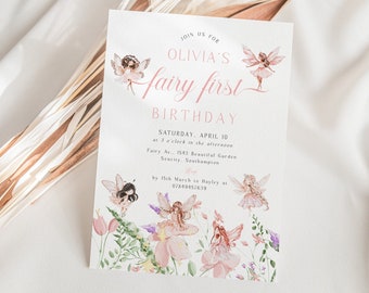 May include: A pink and green fairy-themed first birthday party invitation with a floral design and the text "Join us for Olivia's Fairy First Birthday. Saturday, April 10 at 3 o'clock in the afternoon. Fairy Av., 1543 Beautiful Garden, Seacity, Southampton. RSVP by 15th March to Hayley at 07849457639."