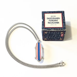 Avon skateboard necklace store
