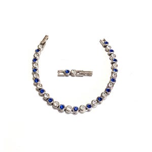Vintage Avon sparkling crystal tennis bracelet art deco clear and sapphire blue color 2002 silver tone with extender September Birthstone