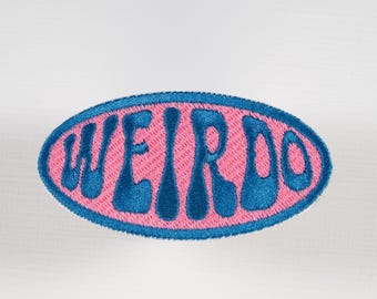 Weirdo Iron-on or Sew-on Machine Embroidered Patch with Blue Lettering on Pink Background