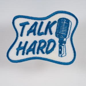 Talk Hard with microphone in white and blue iron-on patch