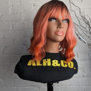 Zacht roze oranje pruik