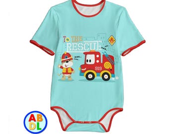 May include: A light blue baby onesie with red trim features a cartoon fire engine and a dog wearing a firefighter helmet. The text "To the Rescue" is printed on the onesie.