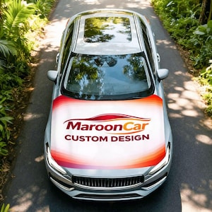 May include: A silver saloon featuring a custom bonnet wrap with a white background and orange, red, and maroon gradient stripes. The bonnet displays the text MaroonCar CUSTOM DESIGN in maroon and orange lettering, centred above the vehicle's front grille.