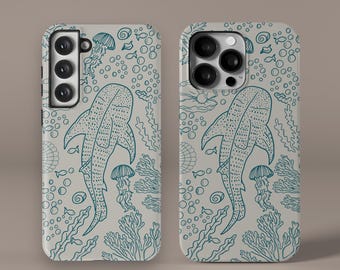 May include: Two phone cases with a white background and a blue and white pattern of a whale shark, coral, and seaweed. The phone cases have a camera cutout on the back.