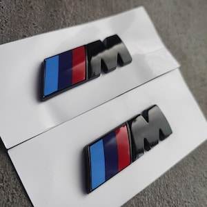 2 pcs BMW M emblem, (fender) 45 x 15 mm NEW Black glossy lettering, self-adhesive, sticker, New in foil