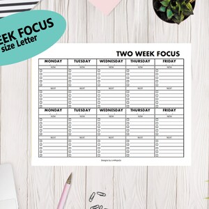 May include: A printable two-week planner with a black and white design. The planner is divided into two sections, each with a grid of seven columns for each day of the week. The days of the week are labeled at the top of each column. The planner is titled "Two Week Focus" at the top.