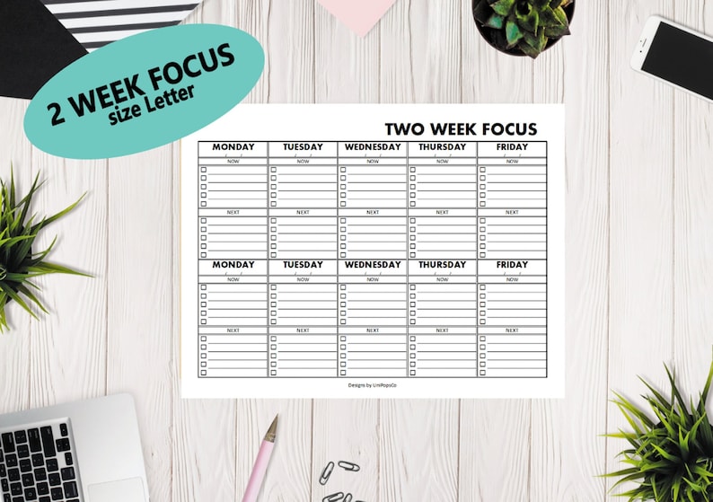 May include: A printable two-week planner with a black and white design. The planner is divided into two sections, each with a grid of seven columns for each day of the week. The days of the week are labeled at the top of each column. The planner is titled "Two Week Focus" at the top.
