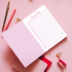 May include: A pink and white assignment tracker with the words "Assignment Tracker" written in pink cursive at the top. The tracker has columns for "Task/Assignment", "Due Date", and "Notes".