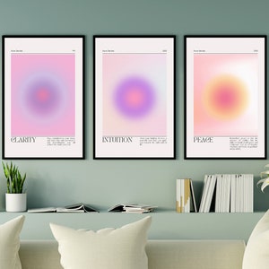 May include: Three framed prints with abstract gradient circles in pink, purple, and orange hues. Each print features a different color scheme and a word at the bottom: "Clarity", "Intuition", and "Peace".