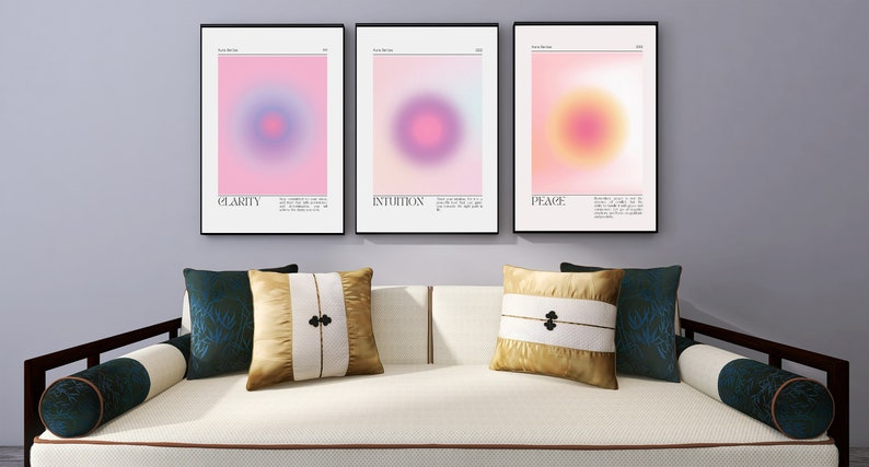 May include: Three framed abstract art prints with a gradient background and a circle in the center. The prints are titled "Clarity", "Intuition", and "Peace".
