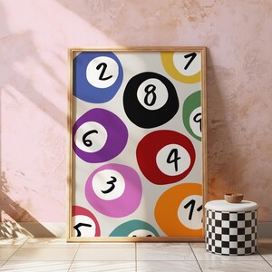 May include: A colorful abstract print featuring a white background with overlapping circles in various colors, each containing a black number from 1 to 9. The circles are arranged in a random pattern, creating a playful and modern design.
