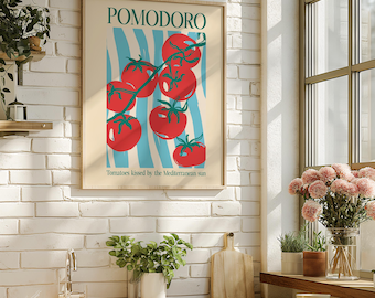 May include: A framed art print featuring the word "POMODORO" above a cluster of red tomatoes with green stems against a cream background with blue stripes. The text "Tomatoes kissed by the Mediterranean sun" is below the tomatoes.