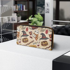 Cartera con cremallera color crema de Gryffindor