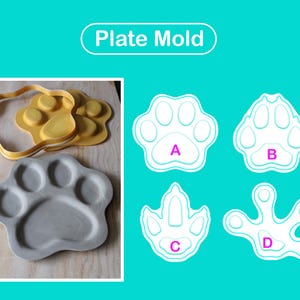 Puede incluir: Un conjunto de moldes para platos Plate Mold con formas de pata en silicona amarilla y gris. La imagen muestra cuatro diseños distintos de huellas de animales etiquetados A, B, C y D, que exhiben varias formas de patas, incluyendo caninas.