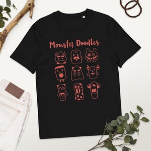Camiseta de algodón orgánico con dibujos de monstruos – Camiseta con un monstruo adorable dibujado a mano – Camiseta ecológica unisex – Regalo divertido de dibujos animados para todas las edades