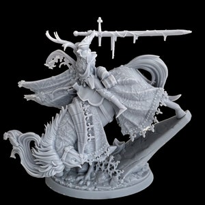 May include: A grey, detailed miniature of a knight riding a winged, dragon-like creature. The knight is holding a sword and wearing armour and a flowing cape. The miniature is set on a circular base.