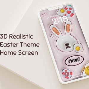 Puede incluir: Una pantalla de inicio de teléfono inteligente rosa y blanca con un tema de Pascua en 3D. La pantalla presenta un conejo blanco con orejas rosas, rodeado de huevos amarillos y un huevo rojo y blanco. La hora es 2:18 y la fecha es miércoles 5 de abril. El texto "Omg!" se muestra en la pantalla.