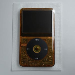 Apple iPod Classic 6:e generationen transparent orange (128 GB Flash Mod - Taptic Engine - 2000 mAh batteri)