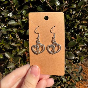 Boucles d&#39;oreilles pendantes en argent à double cœur