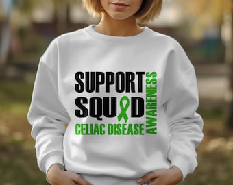 May include: White sweatshirt with black text that reads "Support Squad" with a green ribbon and "Celiac Disease Awareness" written vertically.