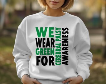 May include: White sweatshirt with the text "WE WEAR GREEN FOR CEREBRAL PALSY AWARENESS" in green and black block letters. The sweatshirt is a crew neck style.