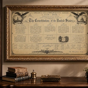 May include: A framed print of the U.S. Constitution, commemorating the 250th anniversary. The text is displayed on a parchment-like background, framed in gold. The print includes eagles and architectural illustrations.