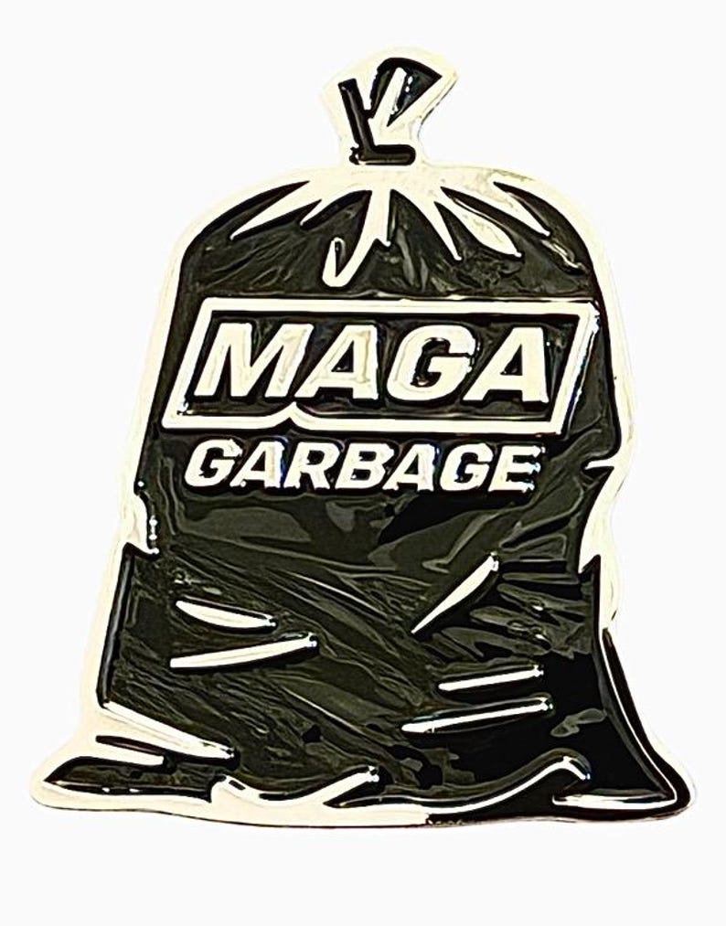 May include: Black and white enamel pin of a garbage bag with the text "Maga Garbage" on the front.