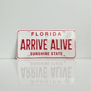 Florida Arrive Alive RED & White Booster License Plate Sunshine