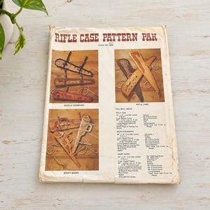May include: A paper pattern packet titled RIFLE CASE PATTERN PAK, stock number 2588. The cover features illustrations of leather rifle cases, saddle scabbards, and sport scopes, along with a detailed list of required materials and tools for crafting.