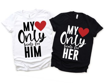 May include: Two black and white t-shirts with a red heart and the text "My Only beats for HIM" and "My Only beats for HER".