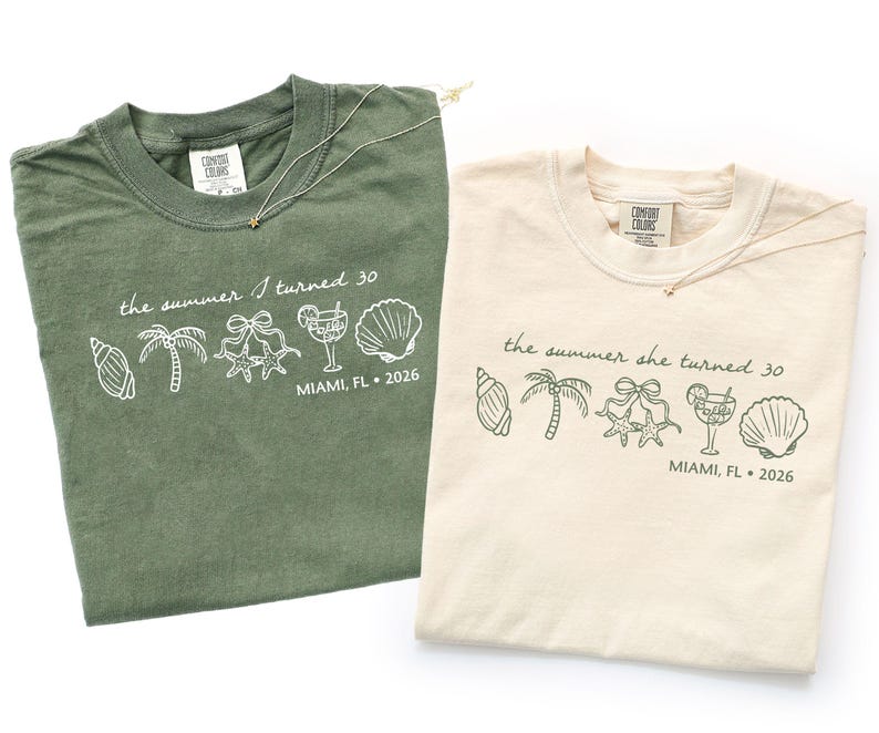 May include: Two t-shirts, one olive green and one cream, with the text "the summer I turned 30" and "the summer she turned 30" printed on them. The shirts also feature line art of seashells, palm trees, and cocktails. The location and year "MIAMI, FL 2026" are also printed on the shirts.