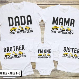 May include: White t-shirts with black text and construction vehicle graphics. The shirts read "DADA," "MAMA," "BROTHER," "SISTER," and "I'M ONE and DIGGIN' IT." The shirts are for a family, with ages 1-3.