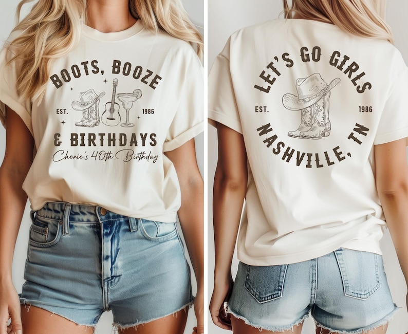 May include: Cream-colored t-shirt with front and back designs. The front features text "BOOTS, BOOZE & BIRTHDAYS" with a cowboy hat, guitar, and cocktail graphic. The back says "LET'S GO GIRLS NASHVILLE, TN" with a cowboy hat and boot graphic.