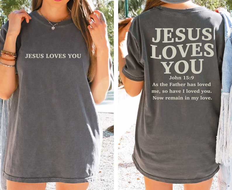 May include: A gray t-shirt with the text "JESUS LOVES YOU" on the front and "JESUS LOVES YOU John 15:9 As the Father has loved me, so have I loved you. Now remain in my love." on the back.
