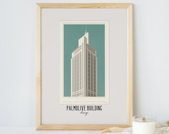 May include: A framed print of a minimalist illustration of the Palmolive Building in Chicago. The building is depicted in white against a teal background. The text "Palmolive Building" and "Chicago" is printed below the illustration.