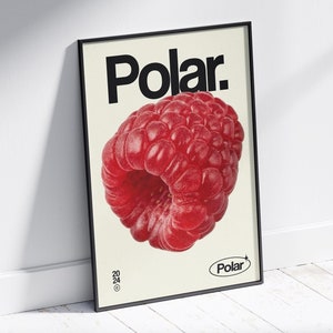 Puede incluir: Un póster enmarcado en negro con la palabra "Polar" en texto negro en negrita y una gran frambuesa roja en el centro. La esquina inferior derecha del póster tiene un pequeño círculo blanco con la palabra "Polar" en texto negro.