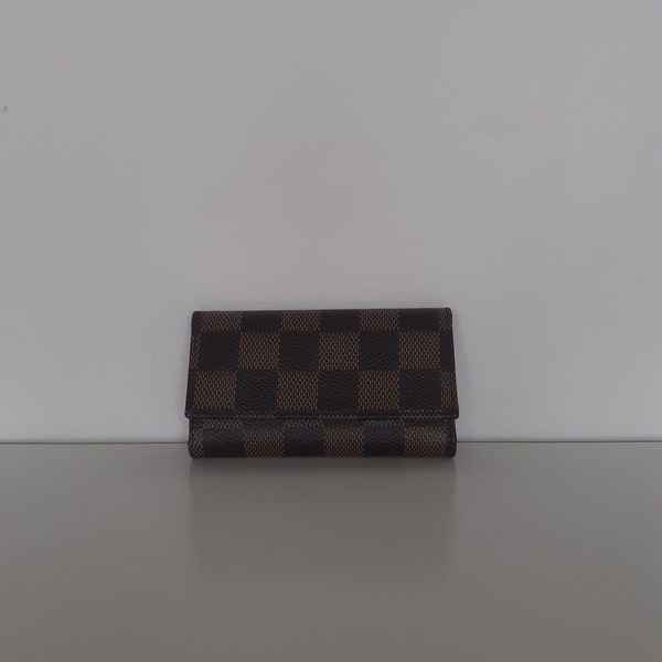 Authentic Louis Vuitton x6 multi-key holder in brown leather