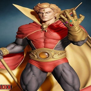May include: A detailed figurine of Adam Warlock, a superhero, in a dynamic pose. He wears a red and gold costume with a cape and a golden belt. His left hand is gloved with the Infinity Gauntlet, and he holds a golden staff. The word "WARLOCK" is at the bottom.
