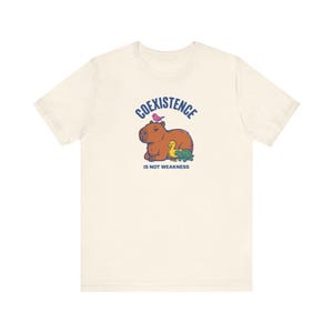 Coexistence Is Not Weakness Capybara Tee, Riso Animal Solidarity Graphic T-Shirt, Calm Resistance Protest Shirt, Kindness Gift image 3