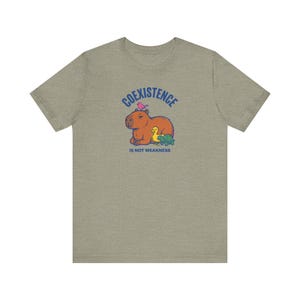 Coexistence Is Not Weakness Capybara Tee, Riso Animal Solidarity Graphic T-Shirt, Calm Resistance Protest Shirt, Kindness Gift image 4