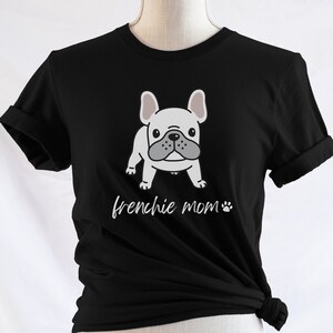 May include: Black t-shirt featuring a white French bulldog illustration and the text "frenchie mom" with a paw print.
