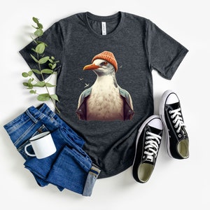Adorable Seagull Wearing a Beanie T-Shirt | Funny Seagull Shirt for Bird Lovers | Unique Seagull Gifts | Seagull with a Knitted Twist Shirt