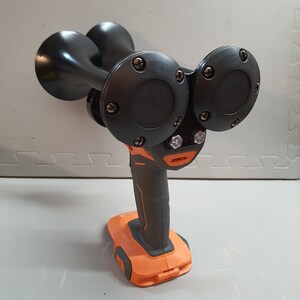 May include: A black electric air horn with two large trumpet-shaped horns and an orange and black battery pack.