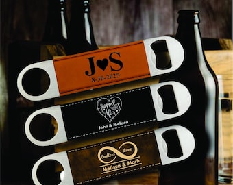 May include: Three personalized bottle openers with stainless steel ends and leather straps. The straps are brown, black, and dark brown, each with custom text and dates. The openers are displayed near dark glass bottles.