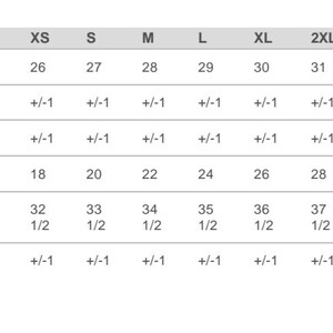 May include: A chart showing finished measurements for clothing sizes XS through 5XL. Measurements are listed for body length, chest width, sleeve length, and tolerance for each measurement.